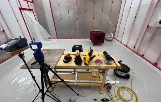 a workbench in a room with a few tools on it