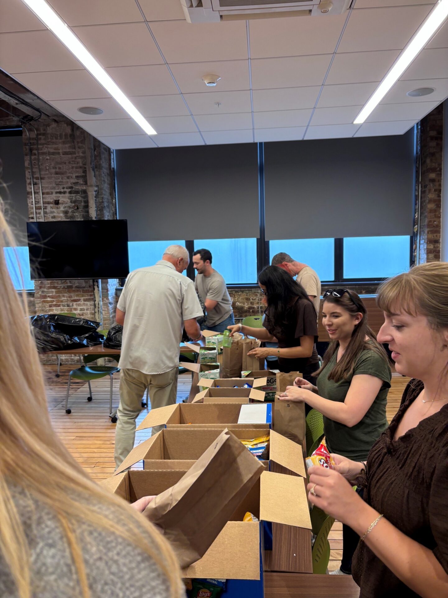 RHP Risk Management staff volunteering with The Night Ministry at the 2026 Annual Firmwide